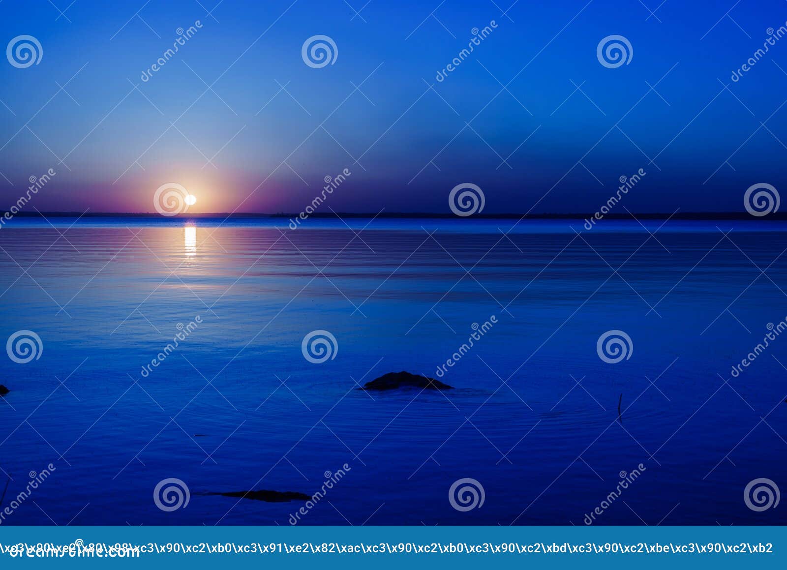 Reflection of a Sunset by a Lagoon Inside the Amazon Rainforest Basin
