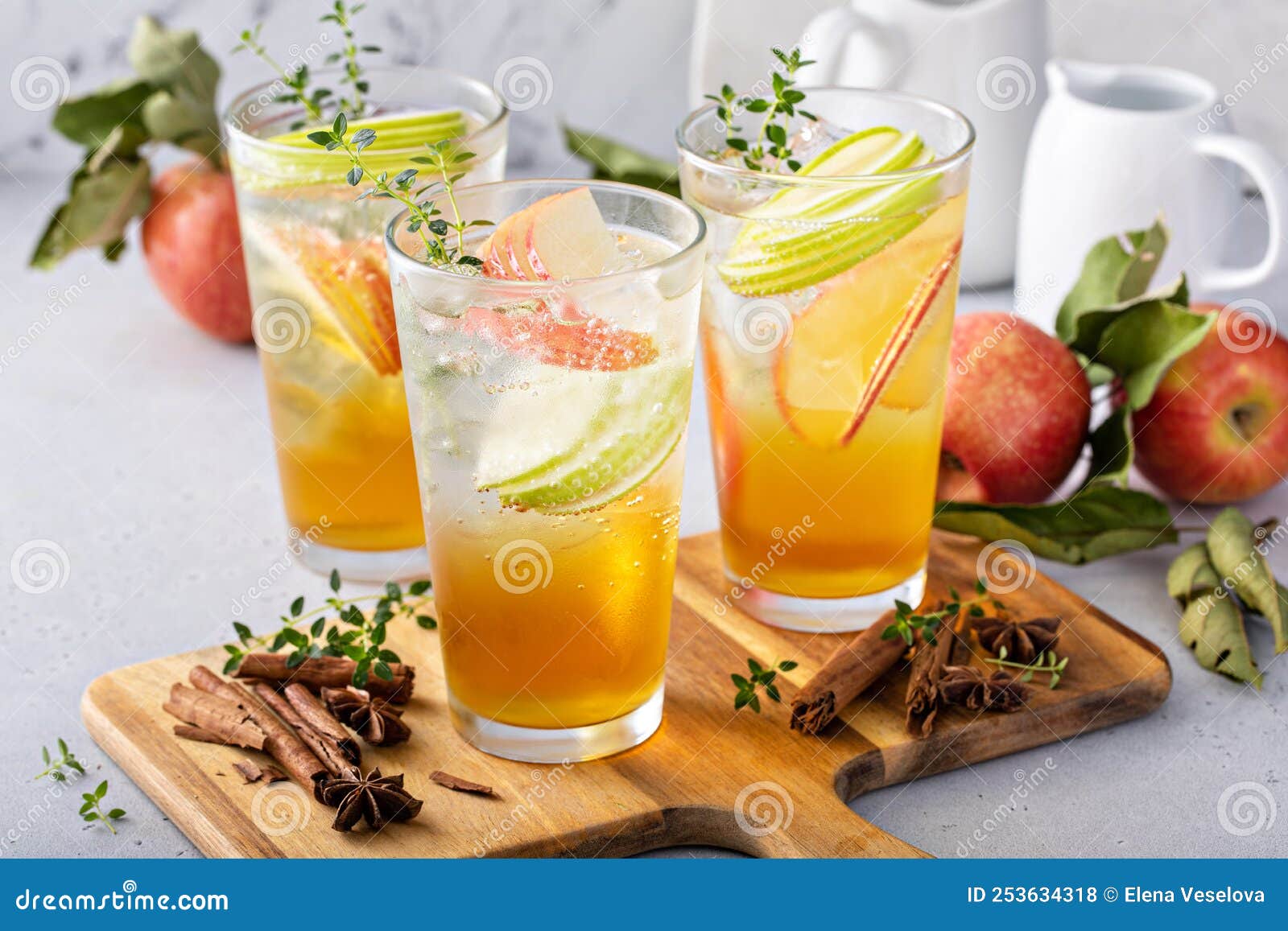 Refreshing Apple Cocktail or Mocktail with Ice and Sliced Apples Stock