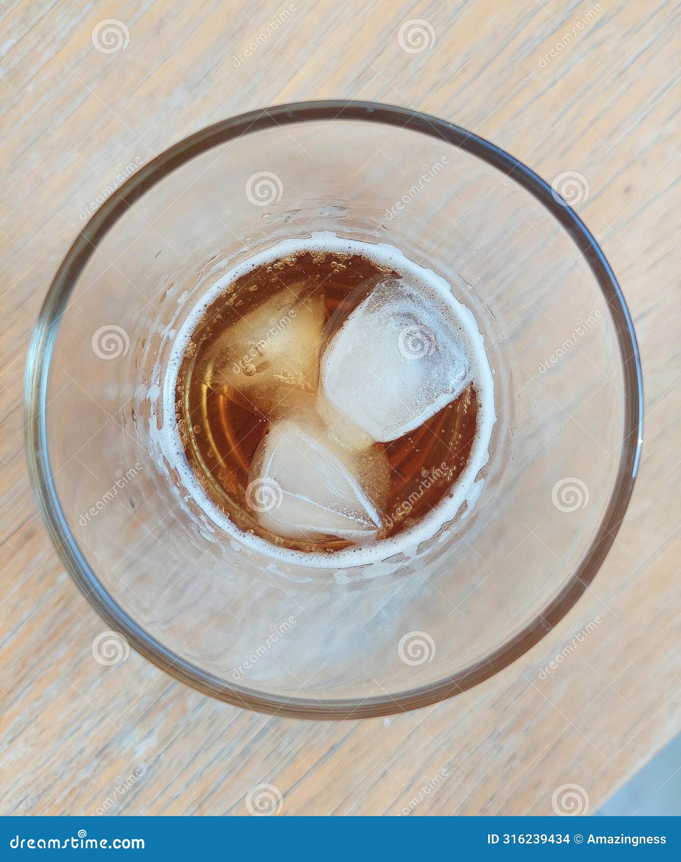 a refreshing glass of iced lemon tea resting on a wooden table, cafÃ© in bangkok.