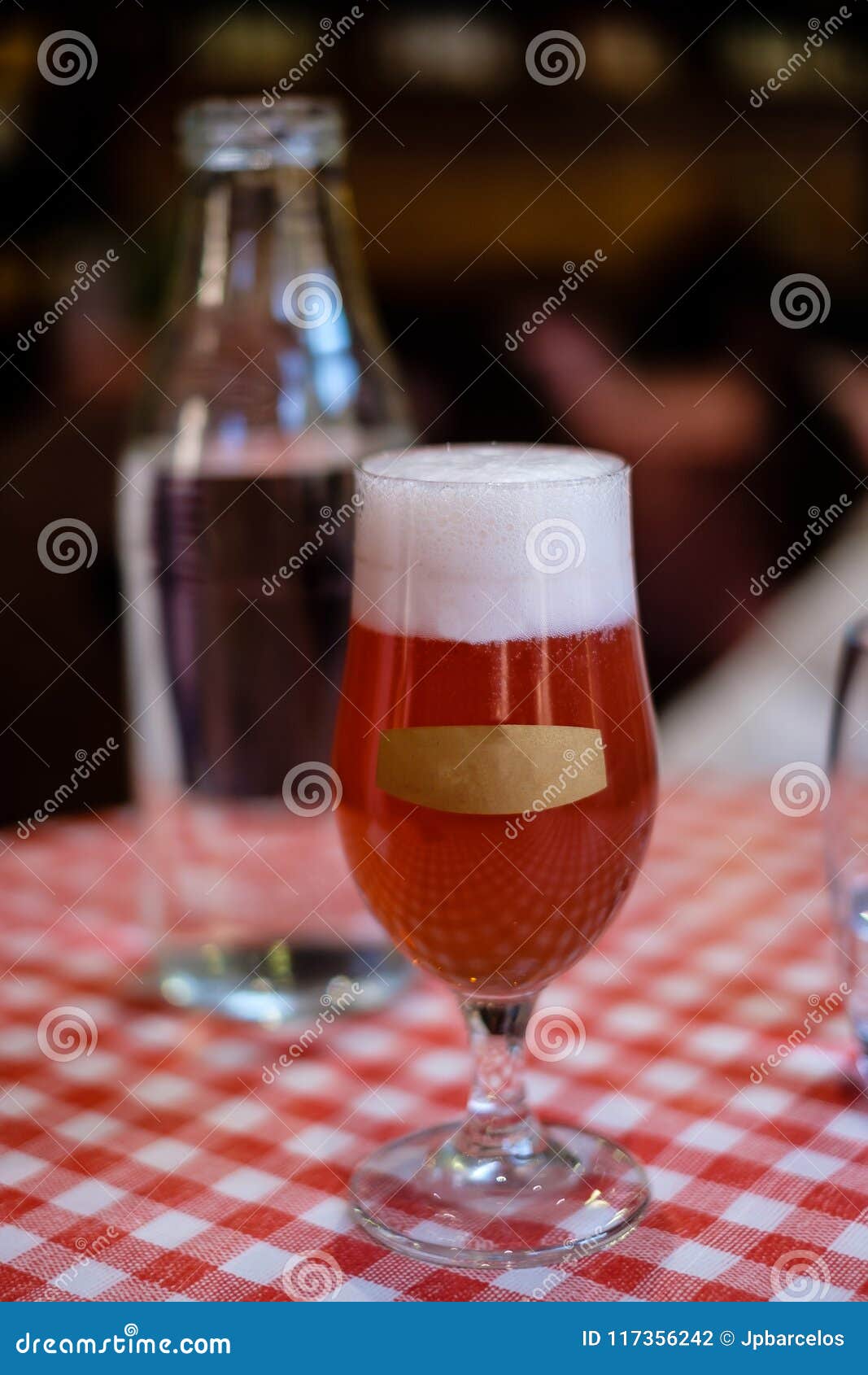 Refreshing Glass of Red Ale Beer with Empty Label on Front of Glass. Stock Photo Image of