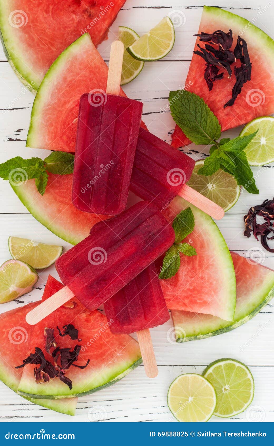 refreshing mexican style ice pops - watermelon, hibiscus, lime paletas - ice pops - popsicles, served on watermelon slices with li