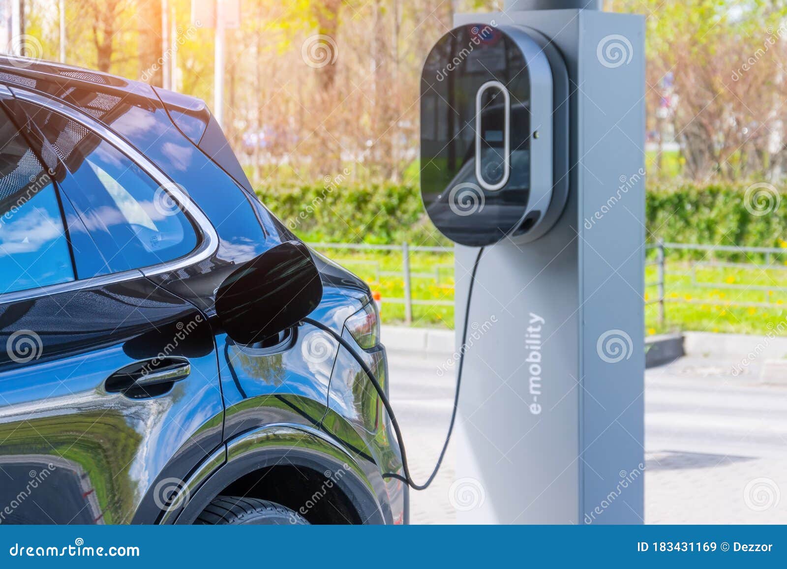 refueling for cars e-mobility. charging an electric car at hybrid engine gasoline and electricity repair shop service garage