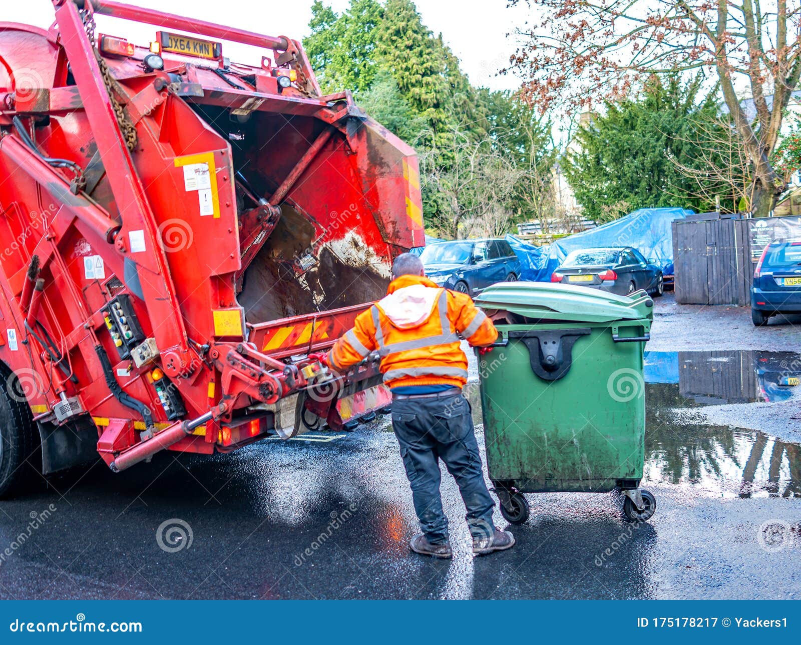 Refuse Collector about To Empty a Bin in the Back of a Bin Lorry
