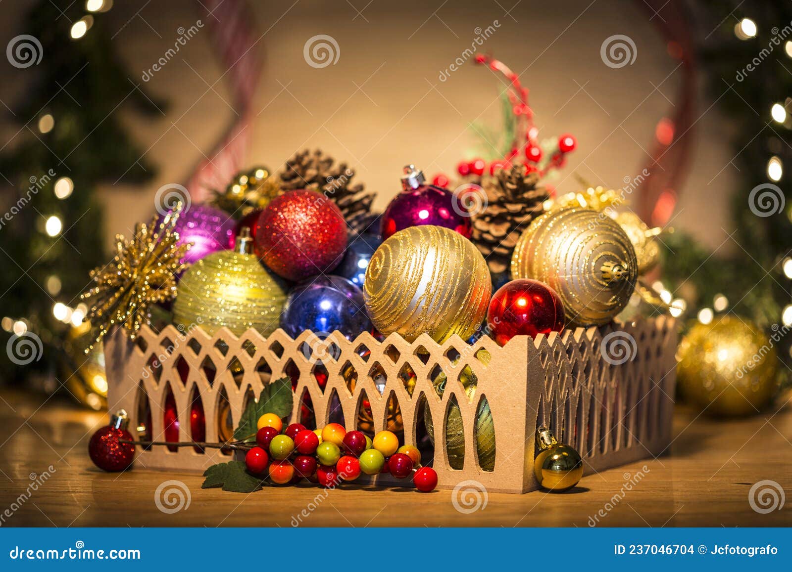 basket with colorful christmas balls and pine cones