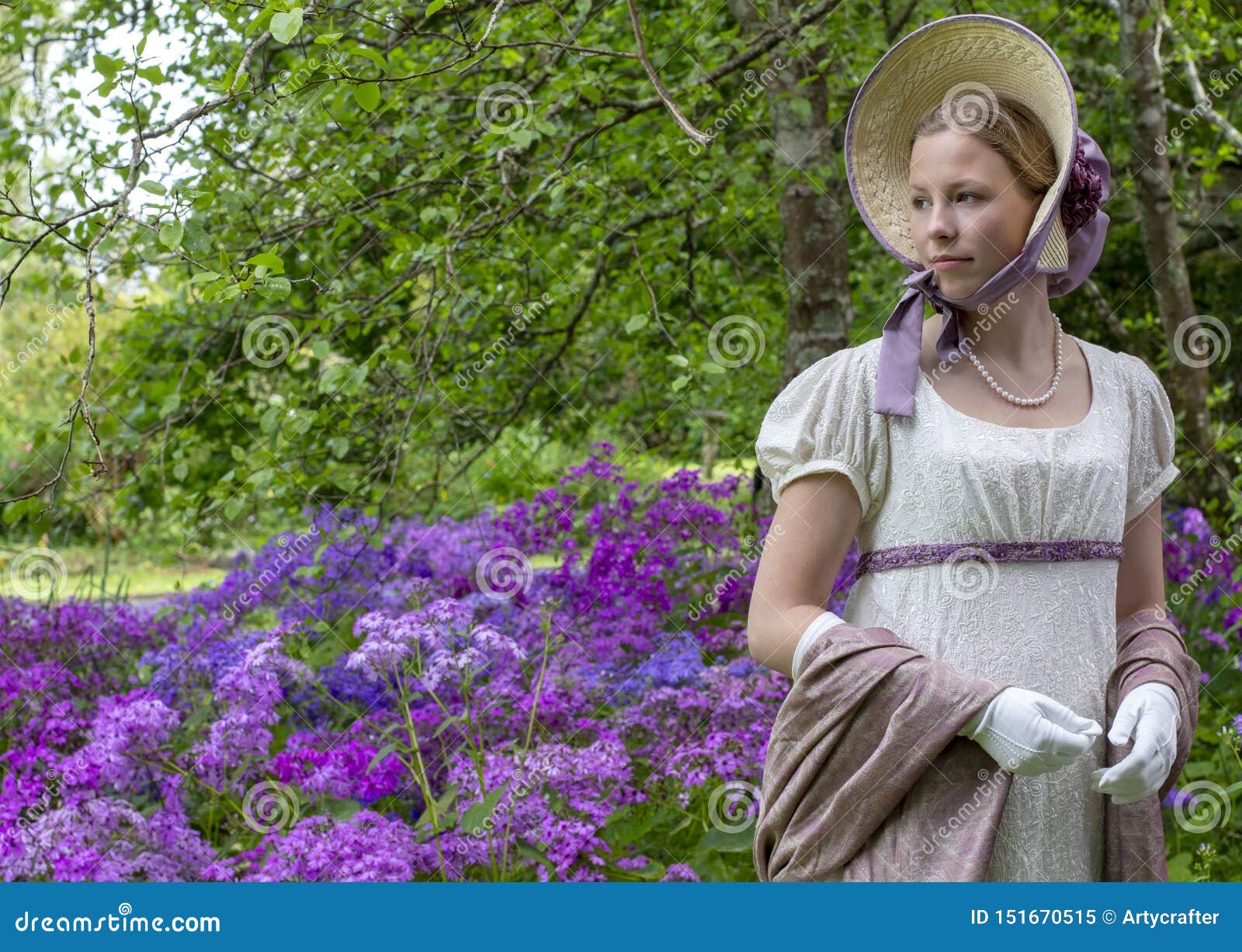 regency woman in a cream dress, paisley shawl and bonnet