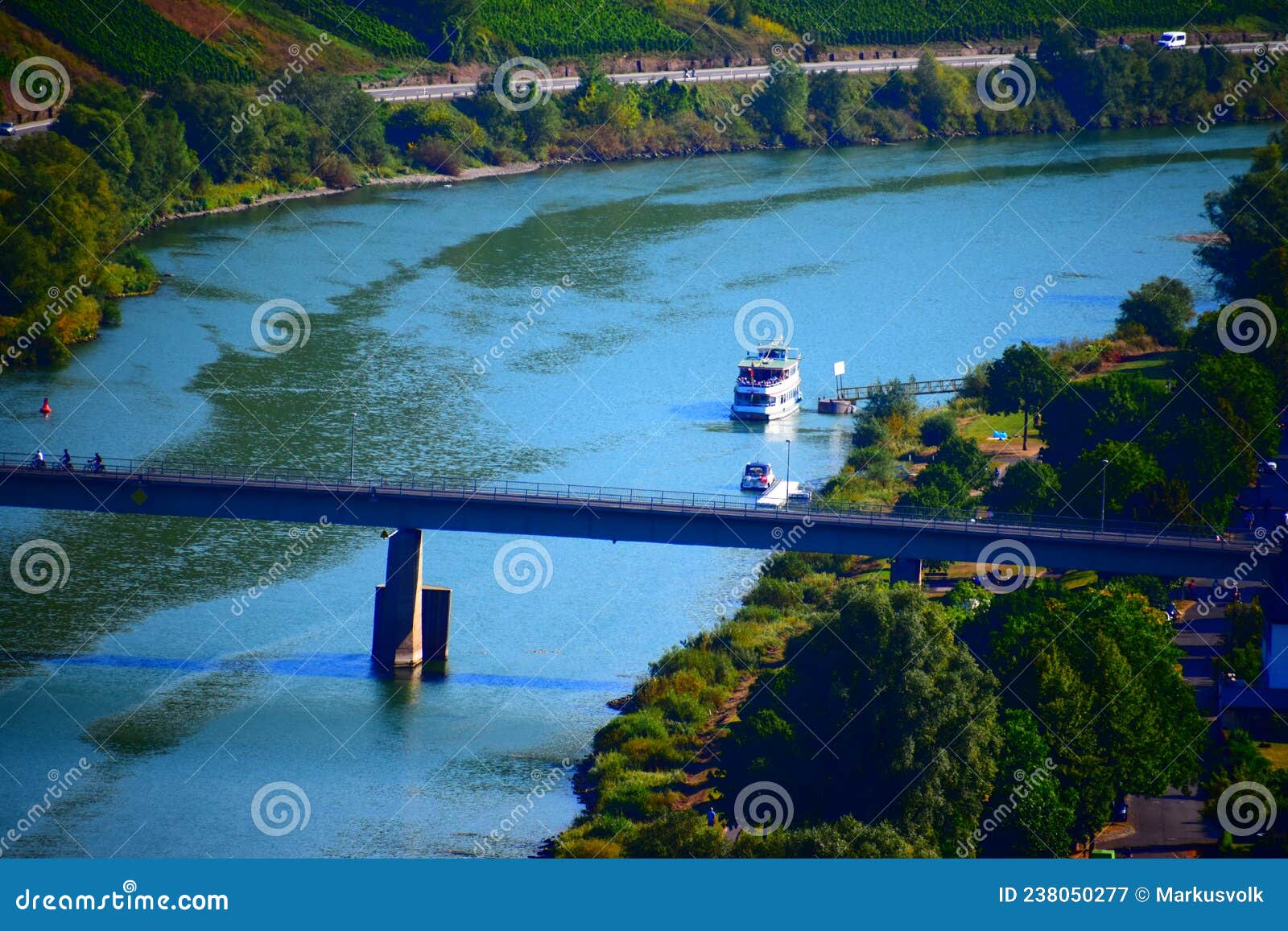 reil, germany - 09 22 2021: mosel bridge reil with a ship at the shore