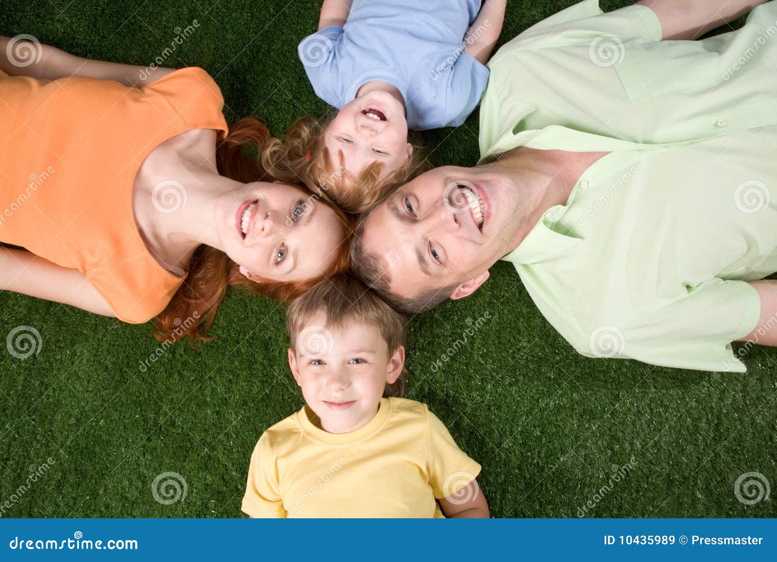 Portrait of family relaxing on the grass together