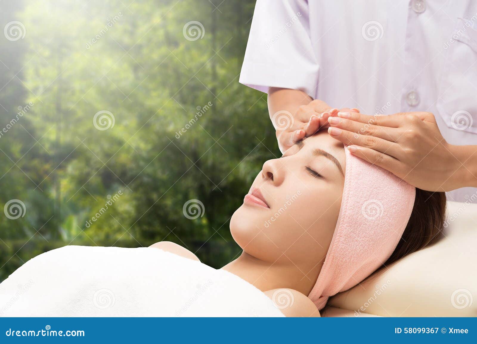 Relax Beautiful Asian Woman Facial Receiving Massage Stock Image