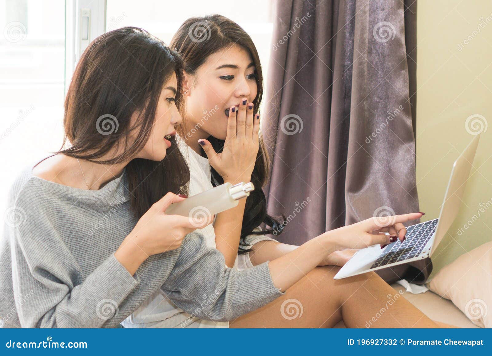 relax girl talk friendships. two asian woman relaxing shopping via ecommerce at home