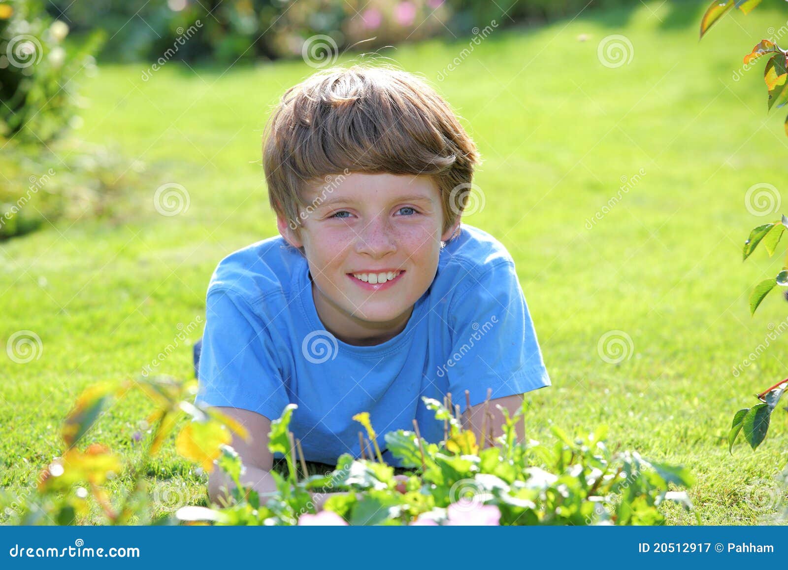 Relaxed boy. Portrait of a relaxed young teenage boy in the garden