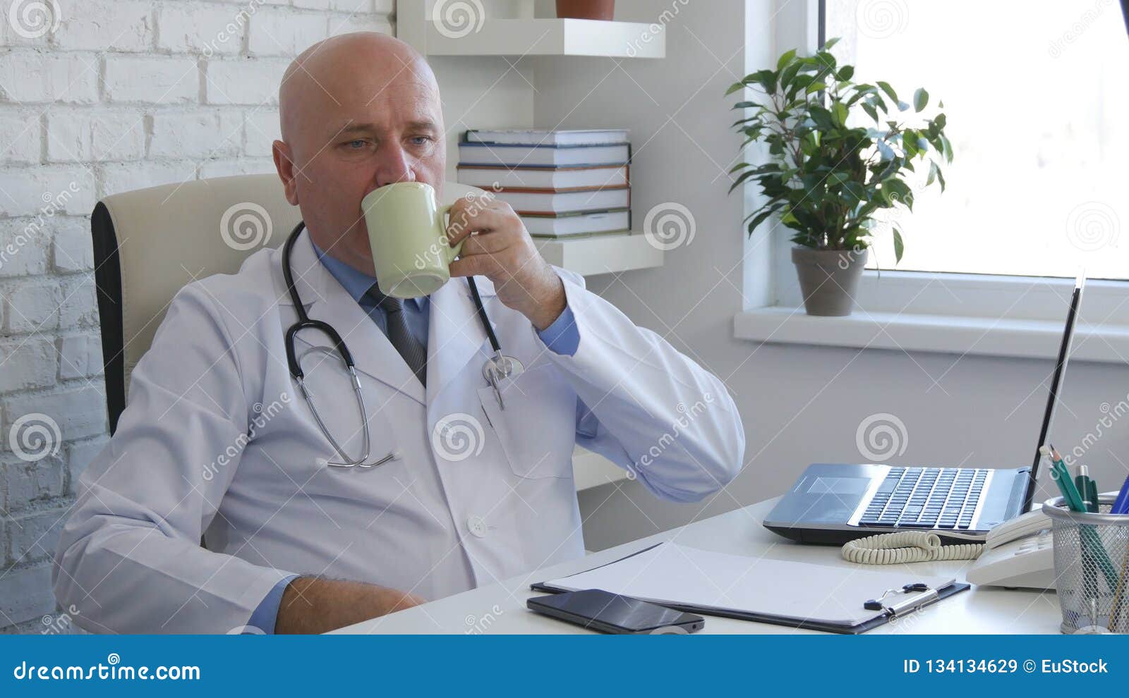 Relaxed Doctor in Office Room Drinking a Coffee Stock Image - Image of ...