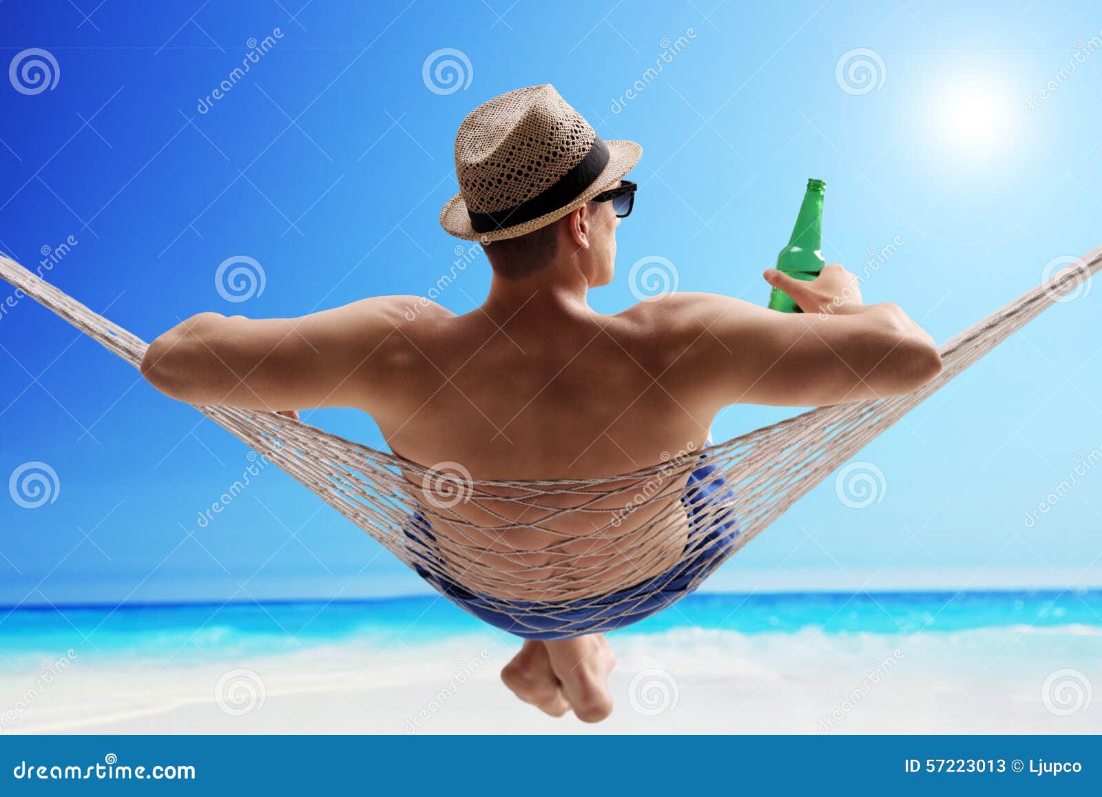 relaxed-guy-lying-hammock-drinking-beer-