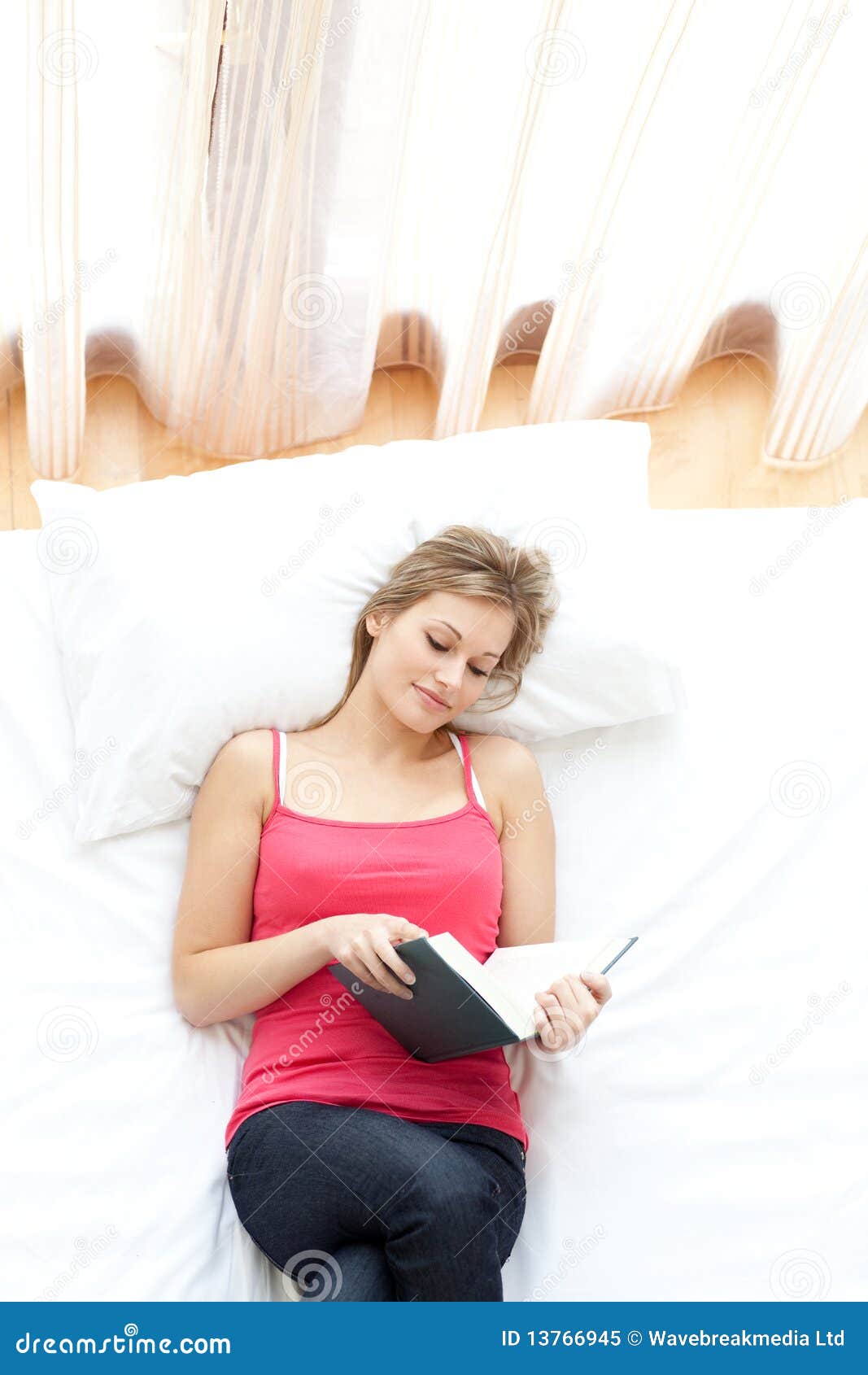 Relaxed Woman Reading on Her Bed Stock Image Image of bedroom, pink