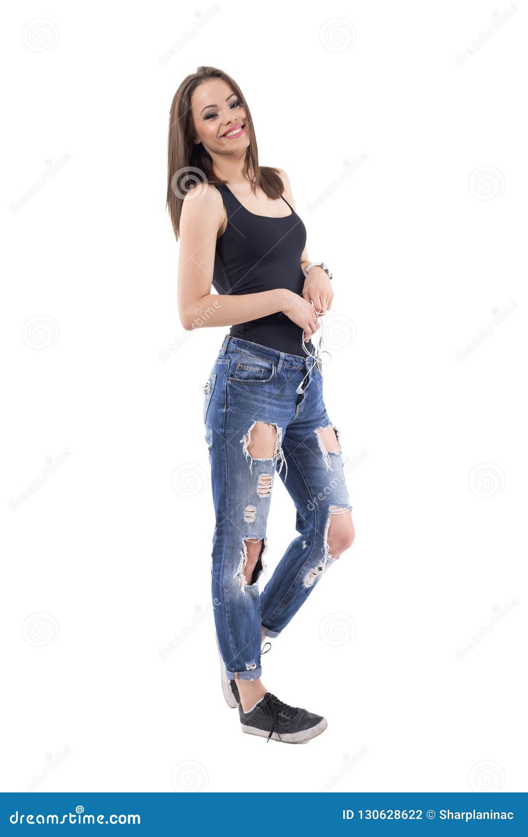 Relaxed Young Stylish Woman Posing Wearing Torn Jeans and Black Top ...