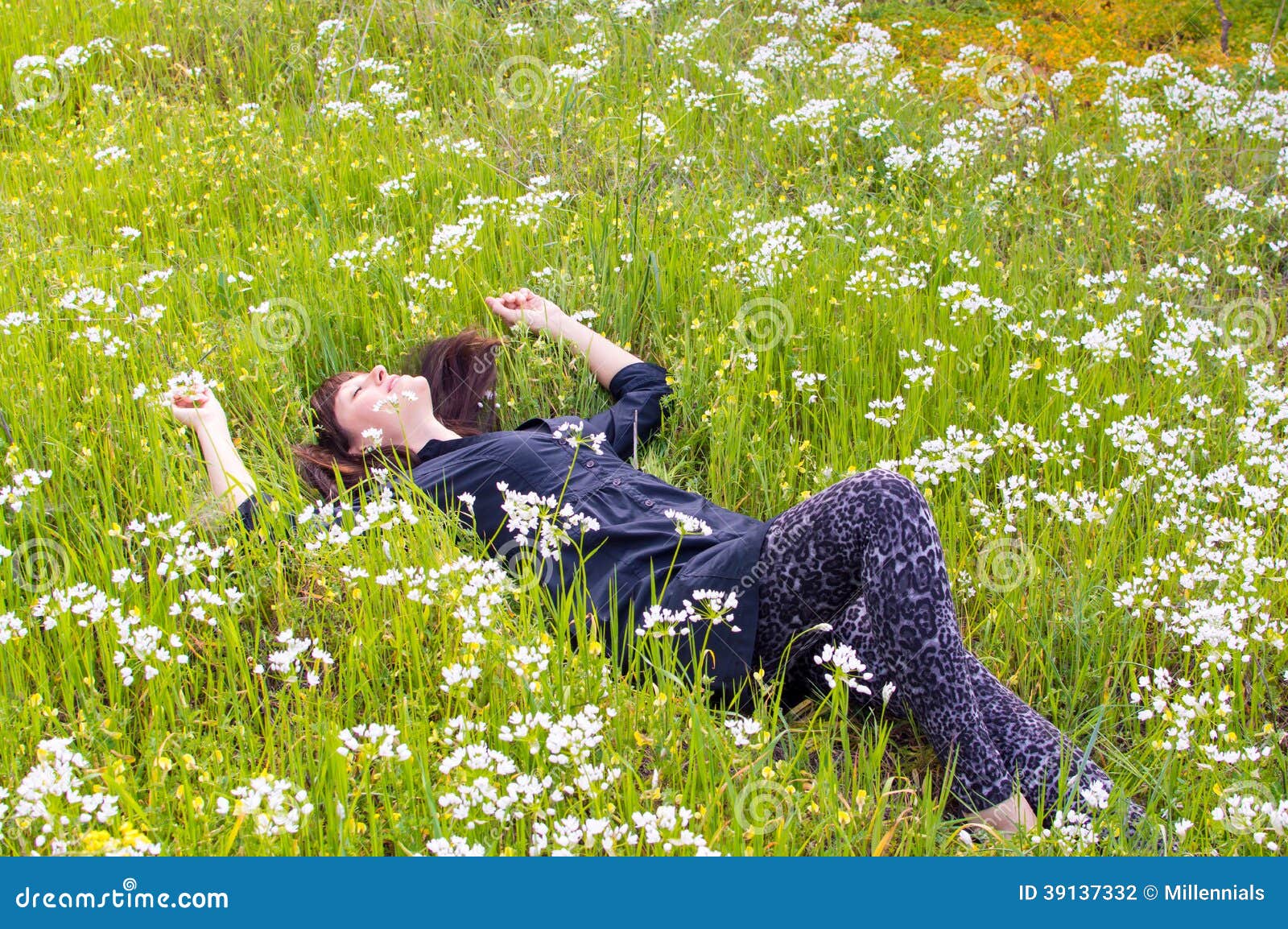 woman relaxing flower field