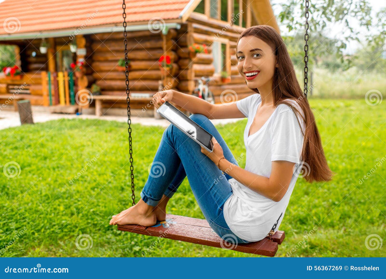 https://thumbs.dreamstime.com/z/relaxing-garden-near-wooden-house-woman-sitting-swing-digital-tablet-eco-vacations-concept-56367269.jpg