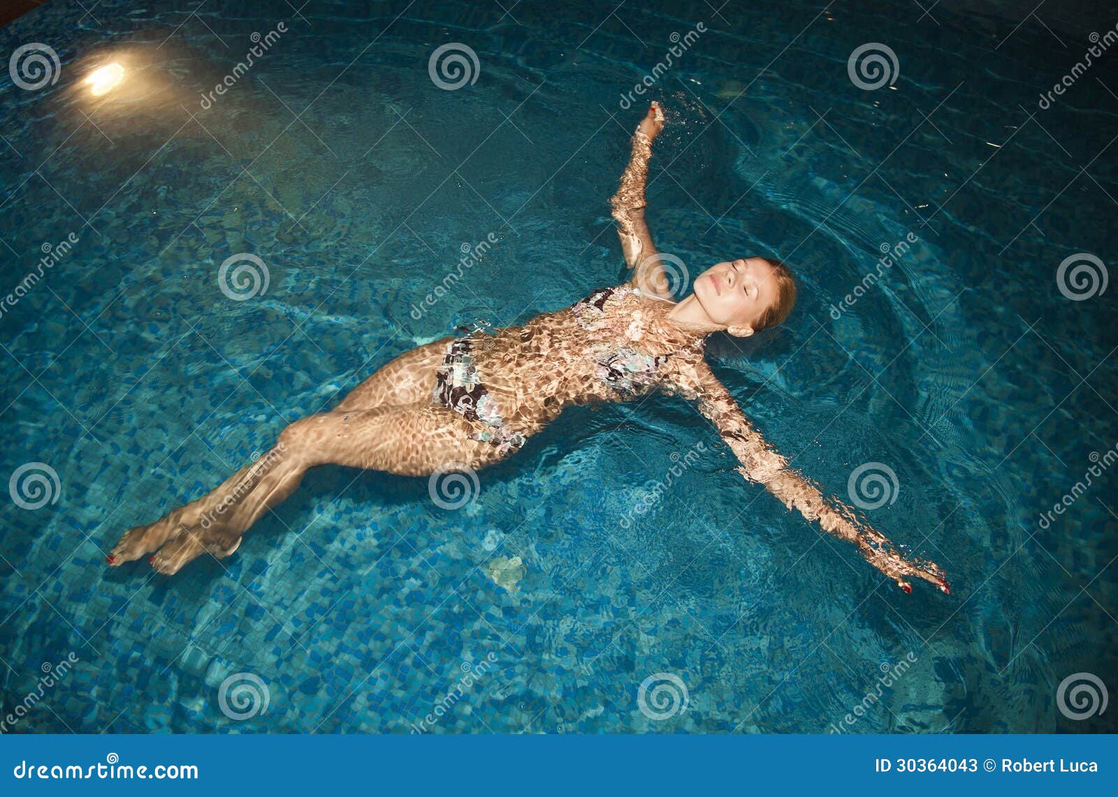 relaxing in the illuminated pool