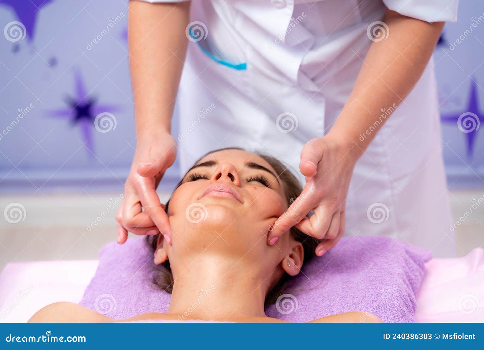 Relaxing Massage European Woman Getting Facial Massage In Spa Salon Side View Stock Image