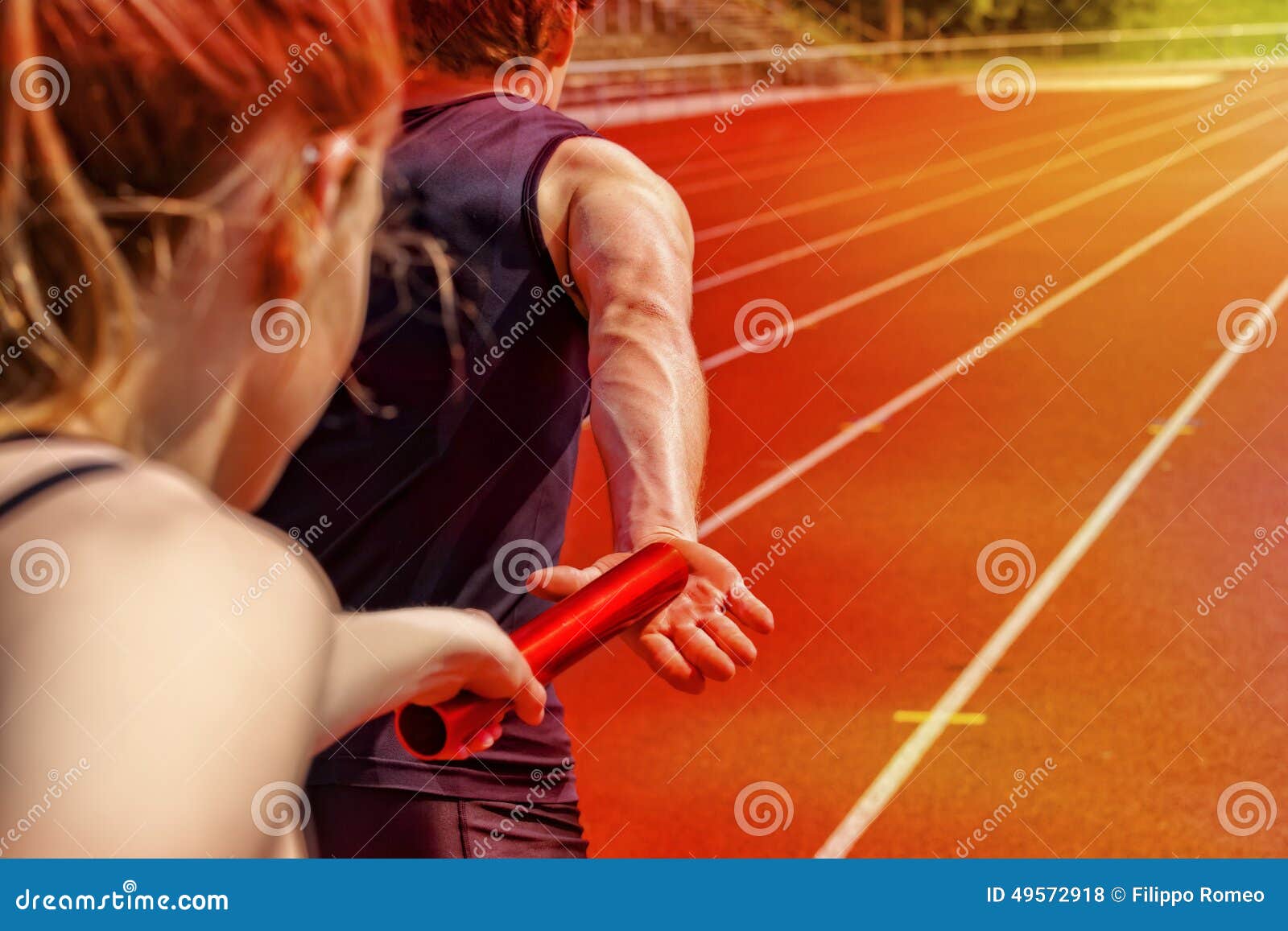 relay race handing over female male