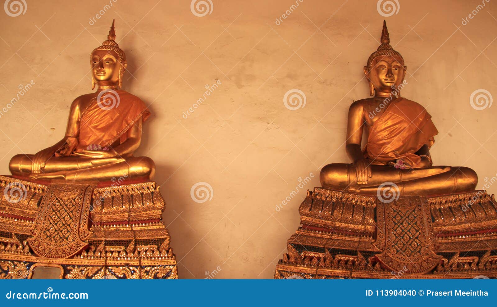 religion. golden buddhas image with mortar walls