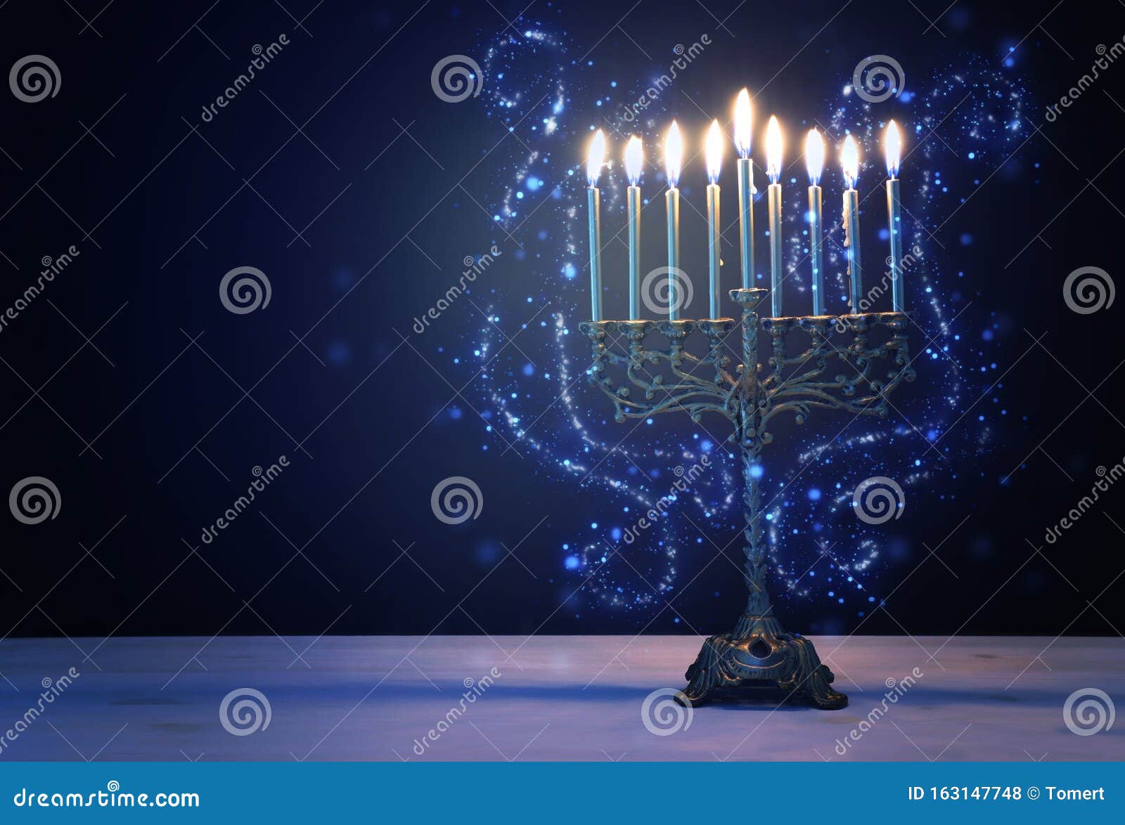 religion image of jewish holiday hanukkah background with menorah traditional candelabra and candles