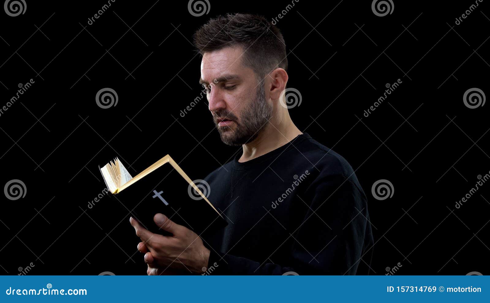 religious believer holding bible, finding answers to questions, faith in god