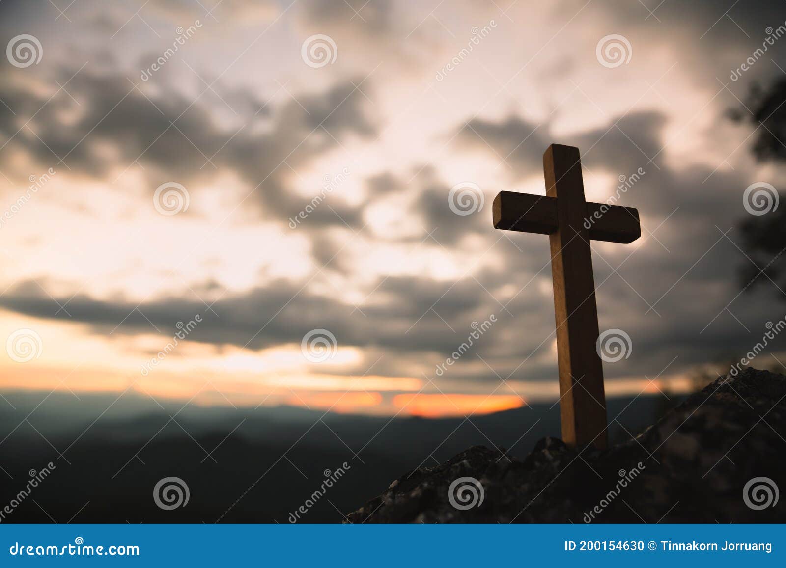religious . christian wooden cross on a background with dramatic lighting,  jesus christ cross, easter, resurrection