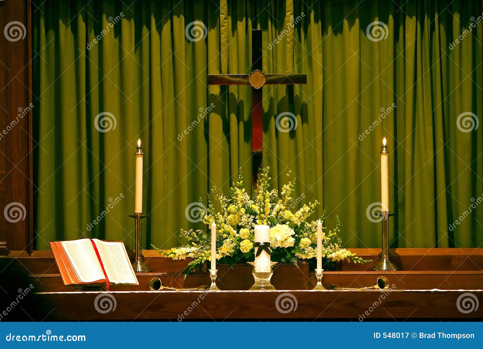 religous altar with bible, cross and candles