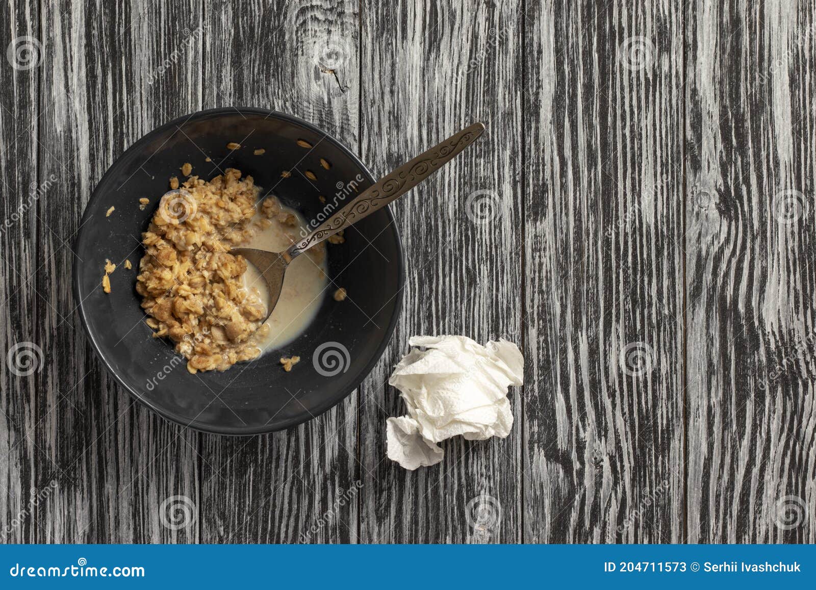 remains of flakes in a plate. remainder of food from a breakfast.
