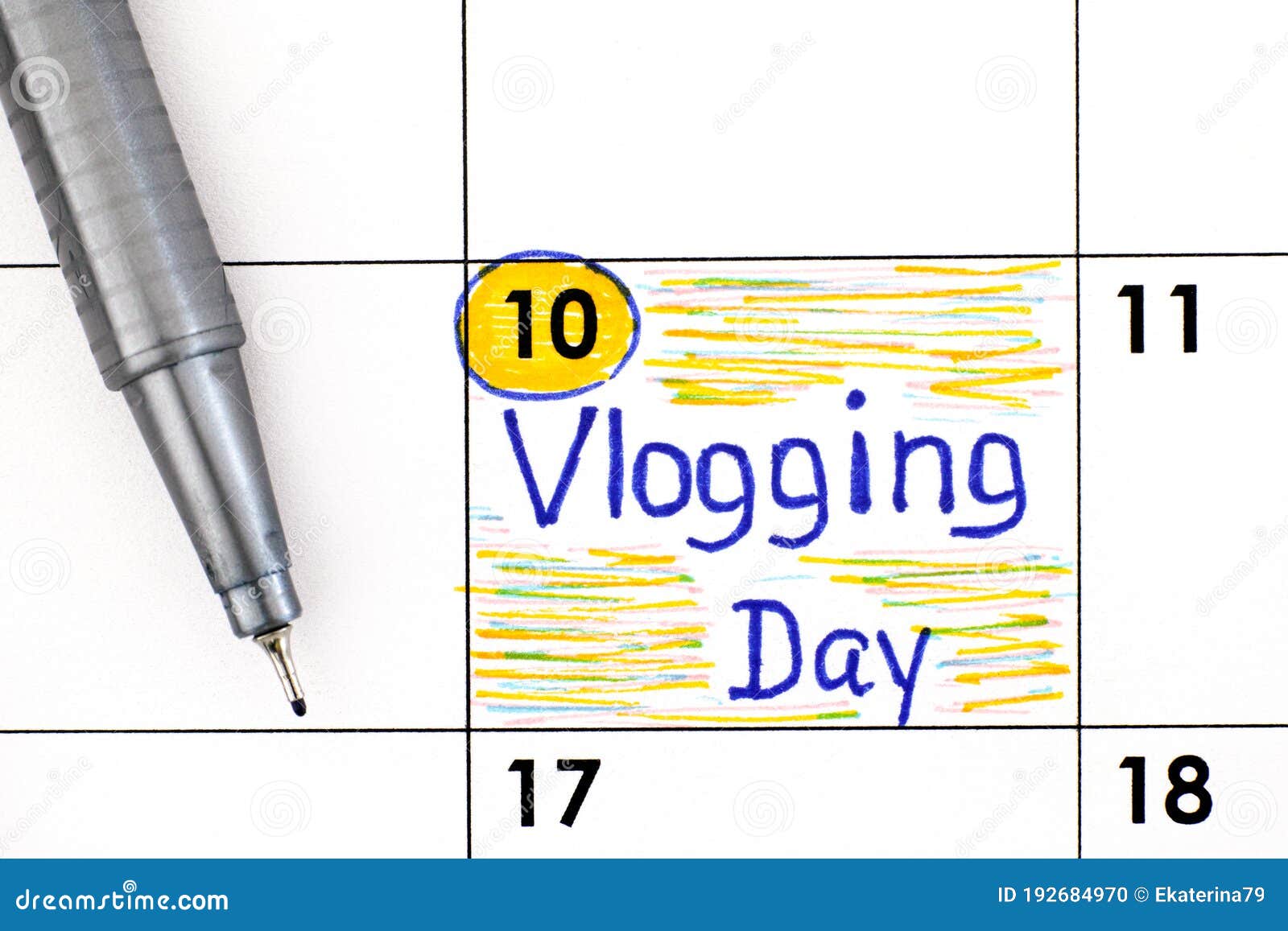 reminder vlogging day in calendar with pen