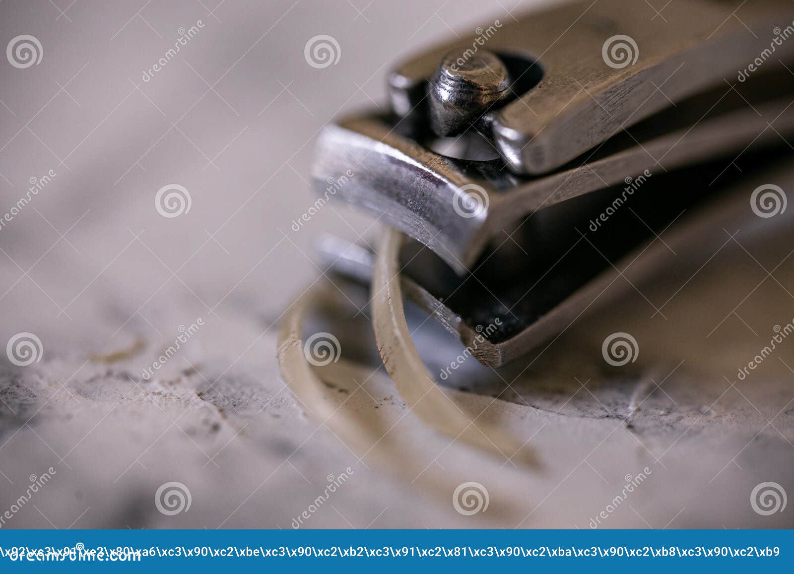 Remnants of a Human Nails Cut Off Using a Nail Clipper. Stock Image