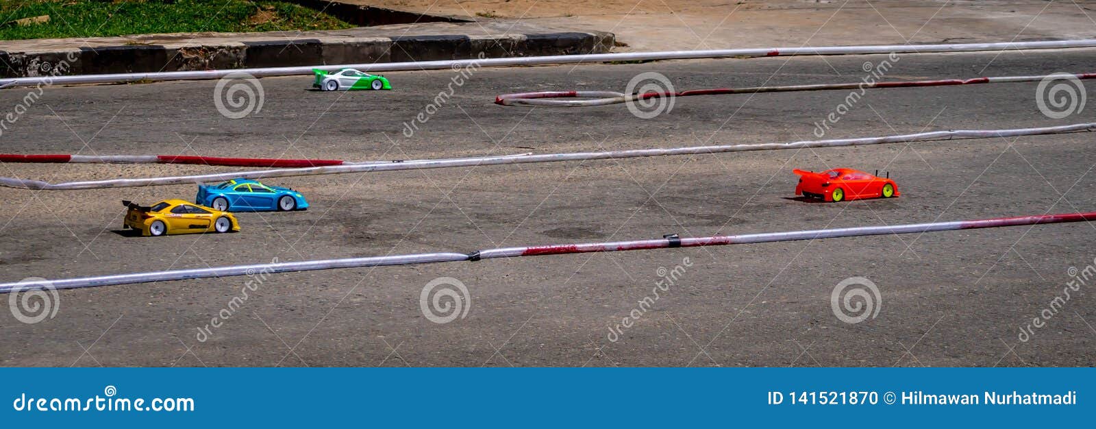 Remote Control Car Race Competition on Tarmac Circuit Stock Photo
