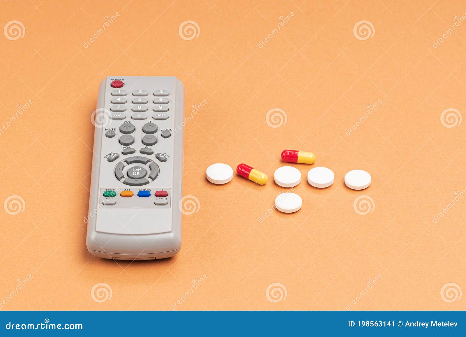 Remote Control and Tablets on an Orange Background Stock Image Image