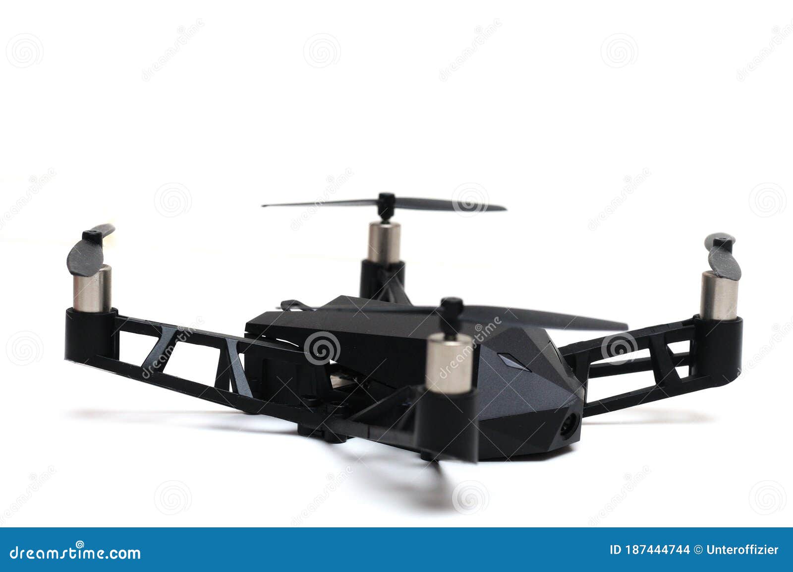 a remote controlled flying drone with four propeller rotors and spy camera on board