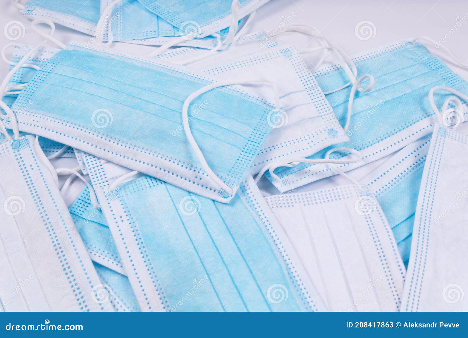 Remote View of Blue Medical Masks with White and Blue Side Up Stock