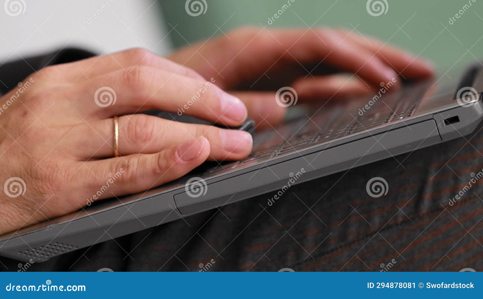 Businessman in Suit Sits and Works at Laptop Out of Office. Remote Work