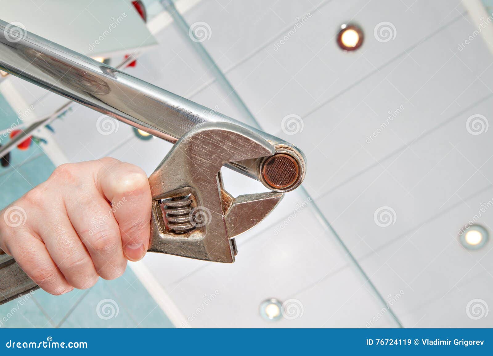 Remove Old Aerator From Faucet With An Adjustable Wrench Close Up