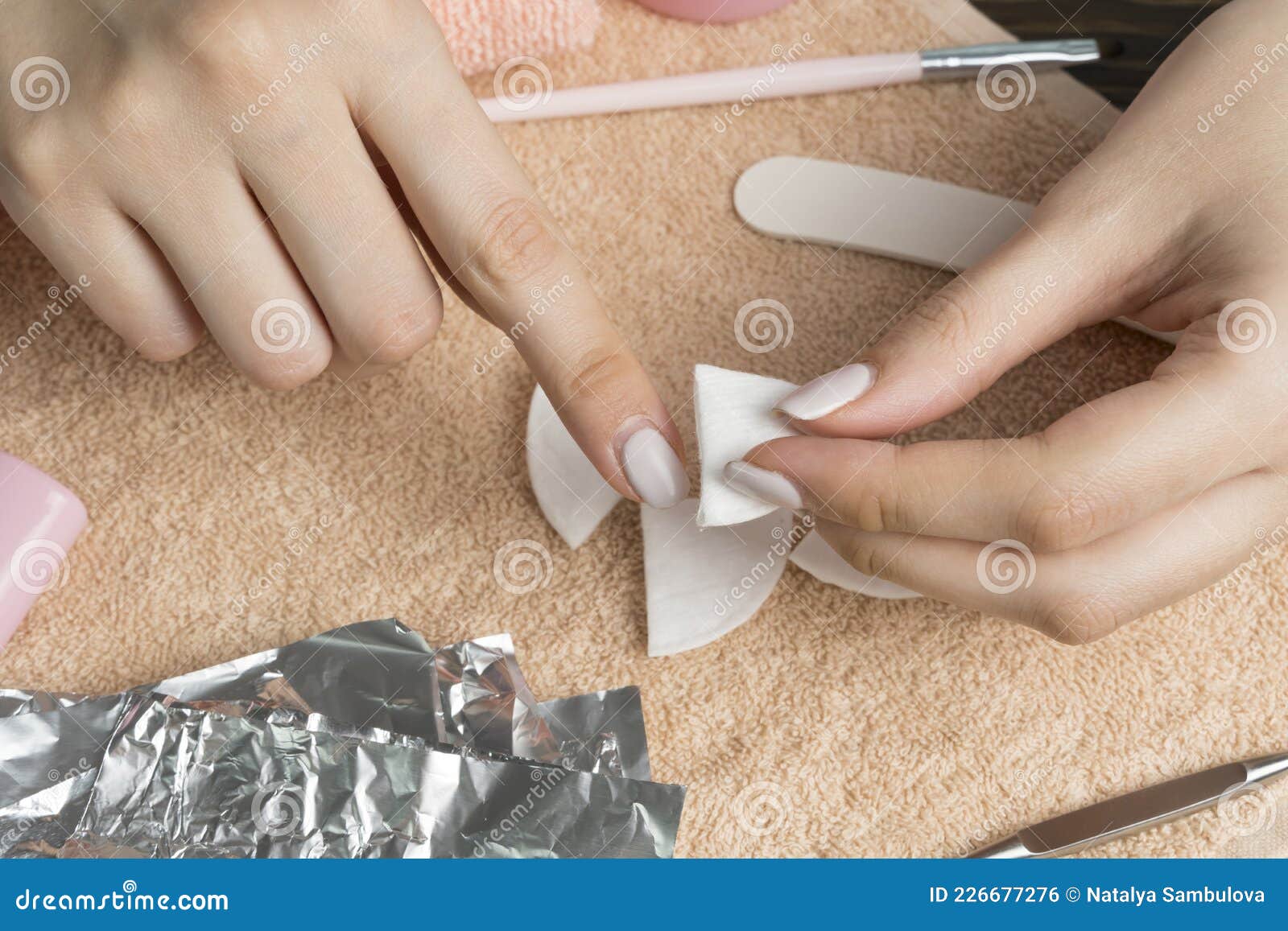 Removing Gel Polish from Nails. Woman Pours Remove Liquid on a Cotton Pad, Puts it on a Nail and Wraps the Foil Stock Photo - Image of manicure, luxury: 226677276 Removing Gel Polish from Nails. Woman Pours Remove Liquid on a Cotton Pad, Puts it on a Nail and Wraps the Foil Stock Photo - Image of manicure, luxury: 226677276