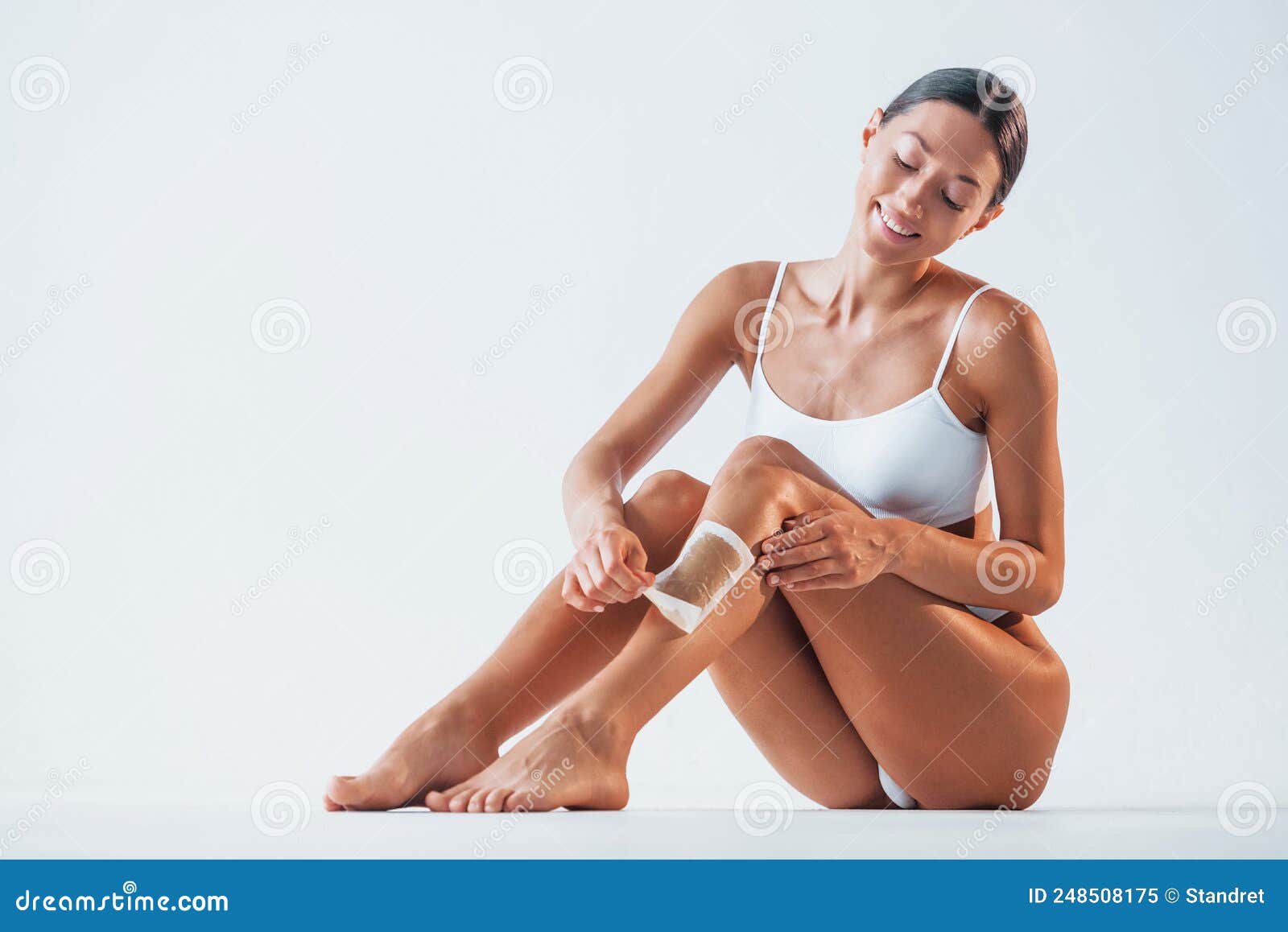 Removing Hair that on Leg. Beautiful Woman with Slim Body in Underwear is  in the Studio Stock Image - Image of athletic, model: 248508175