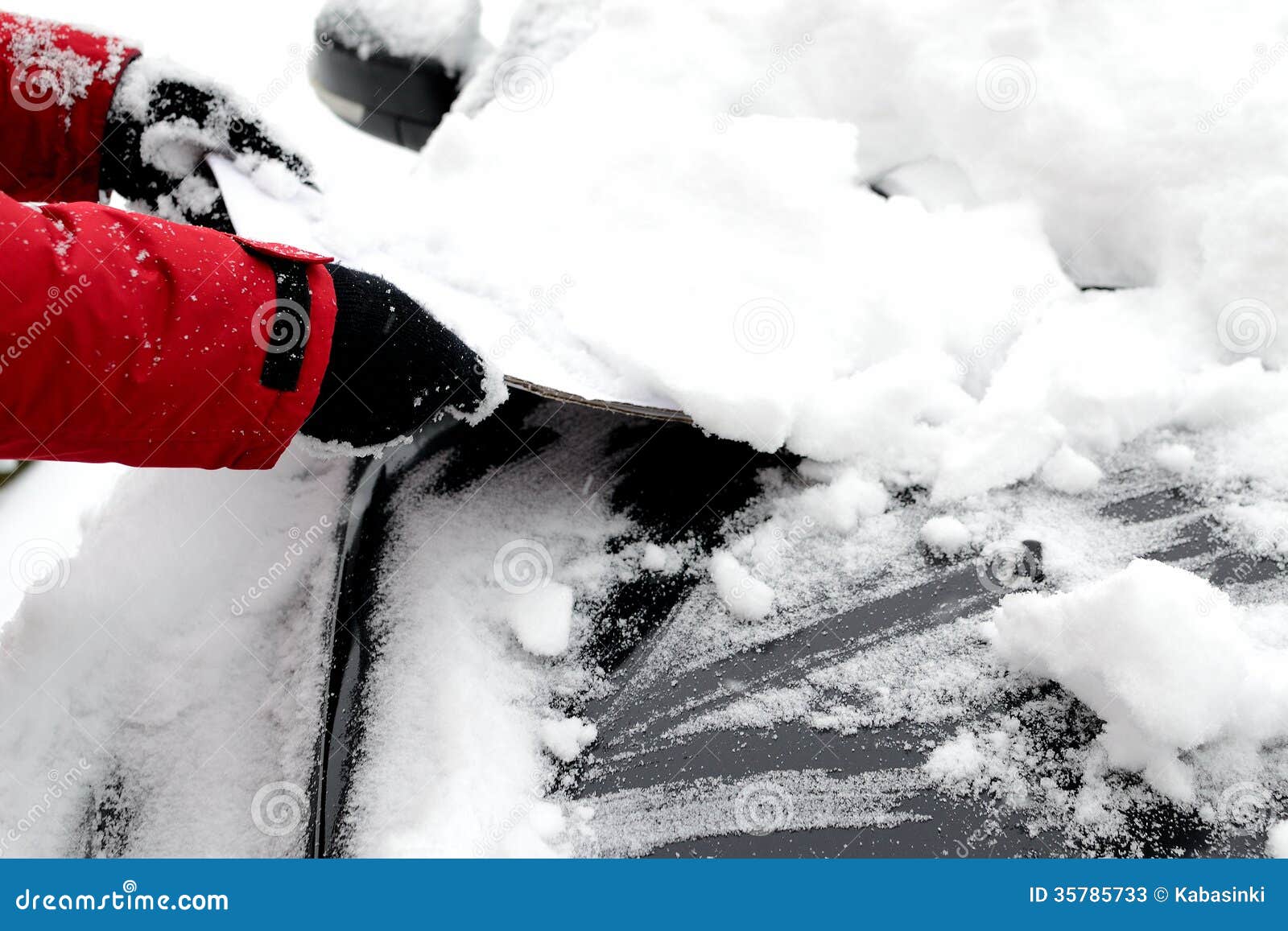 Removing snow from the car stock image. Image of snowing 35785733