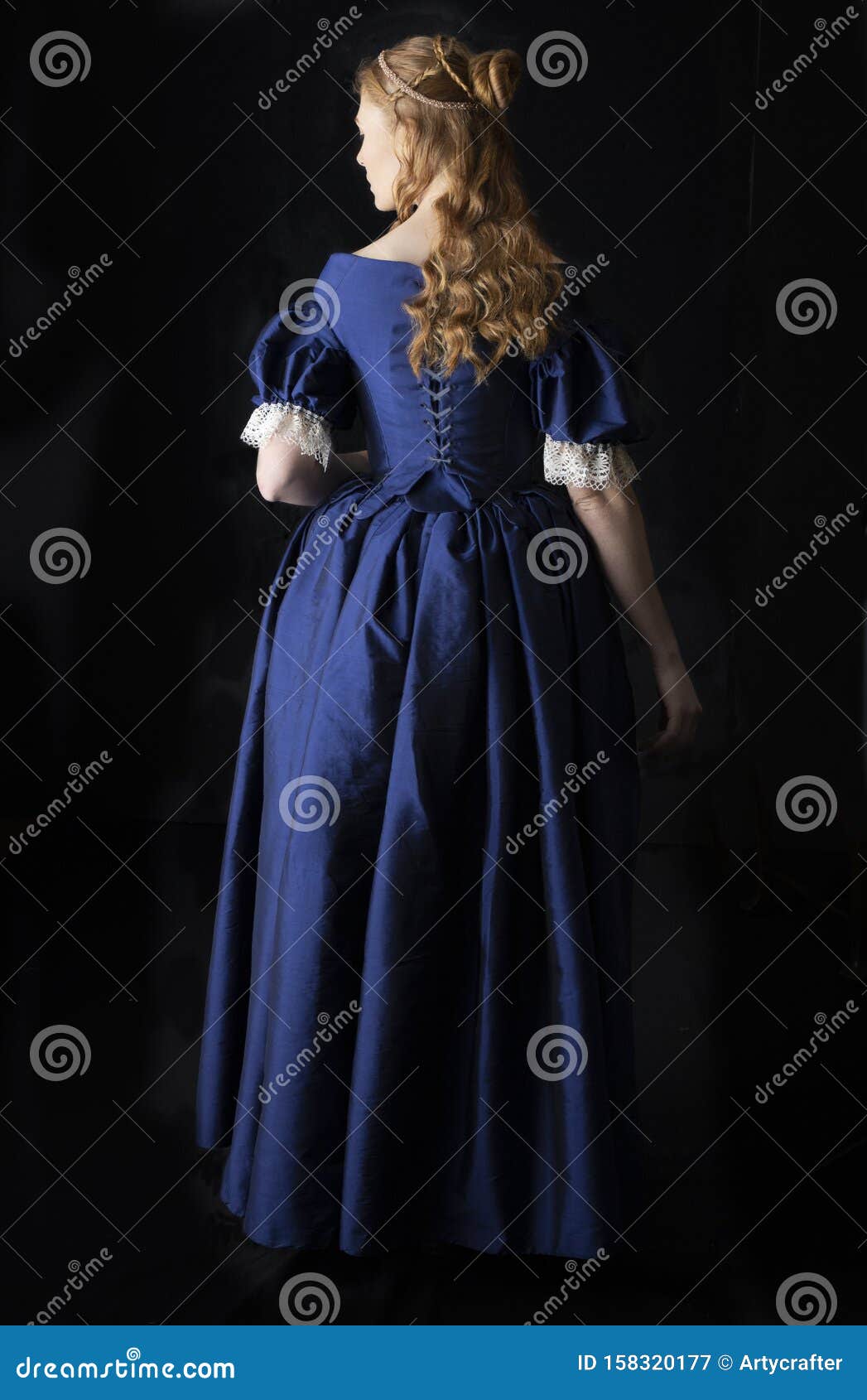 renaissance century woman in a blue  silk gown