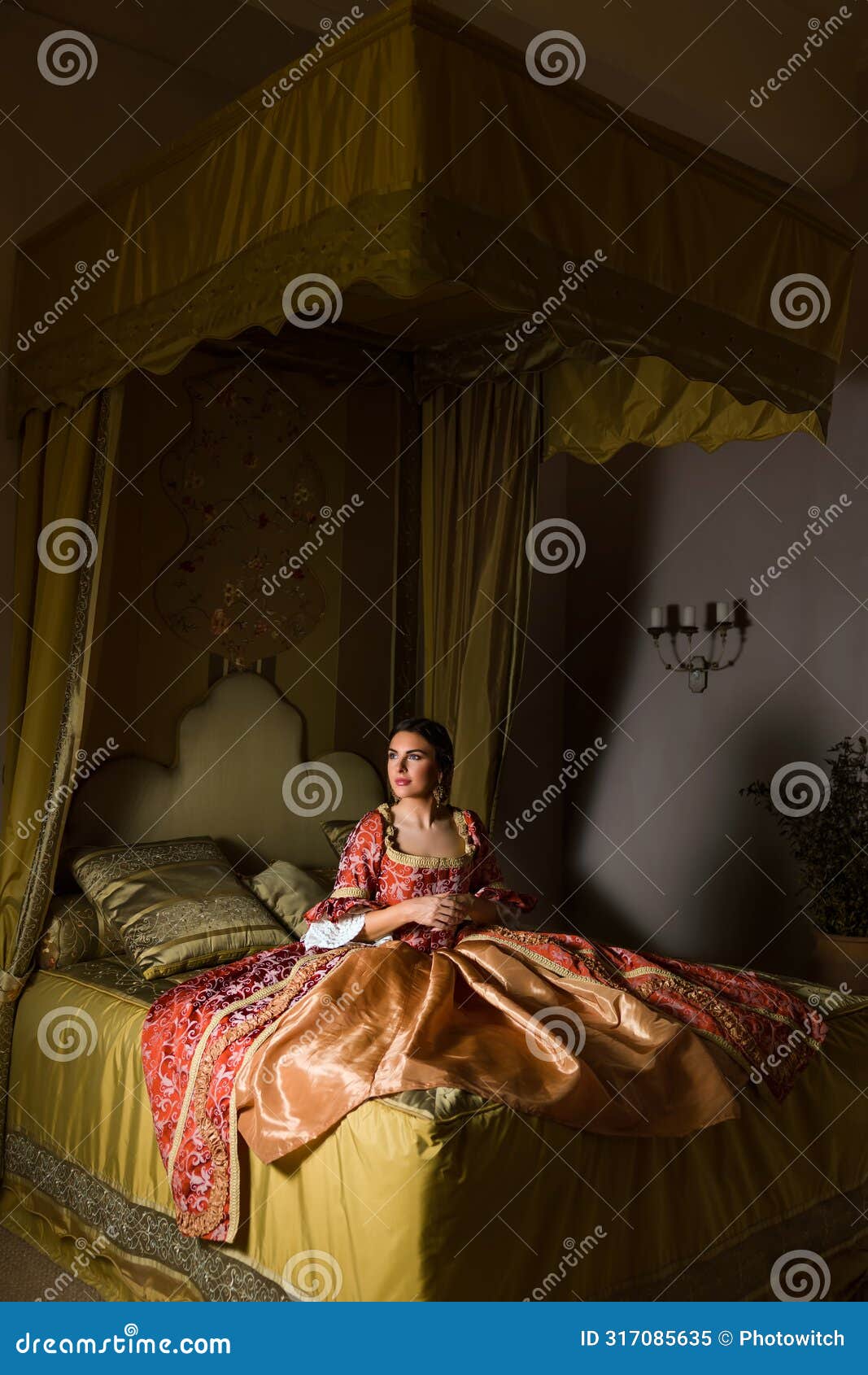 renaissance woman on golden canopy bed