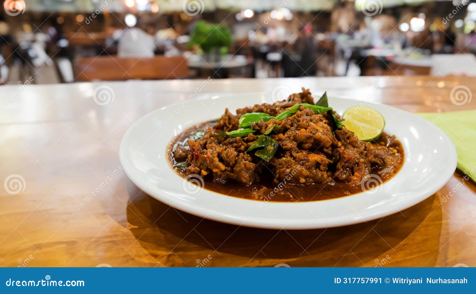 rendang padang on top table and blur resto background. generative ai
