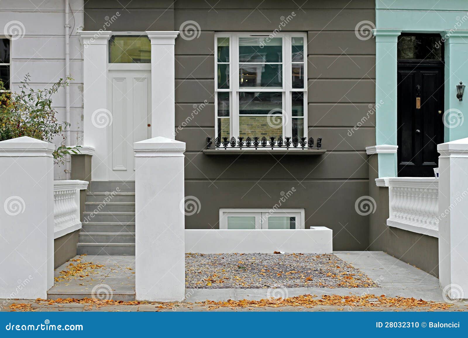 Newly renovated house exterior with fresh white paint