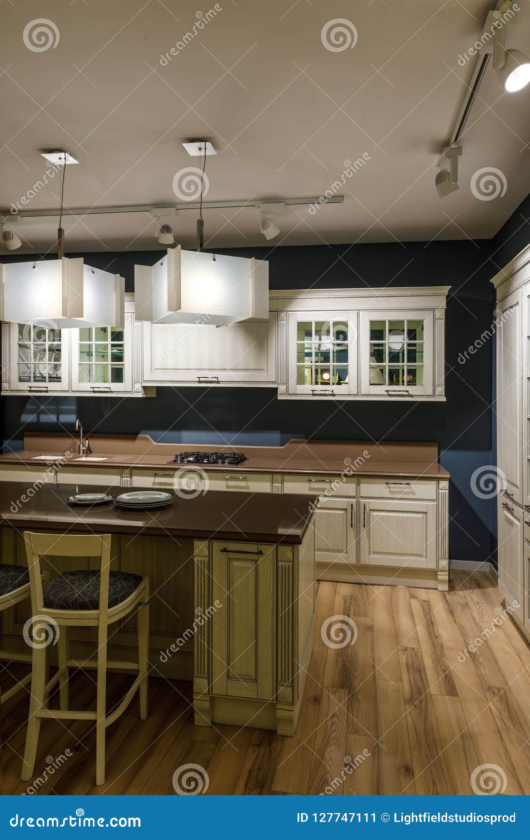 Renovated Kitchen Interior with Lamps Over Counter Stock Image Image