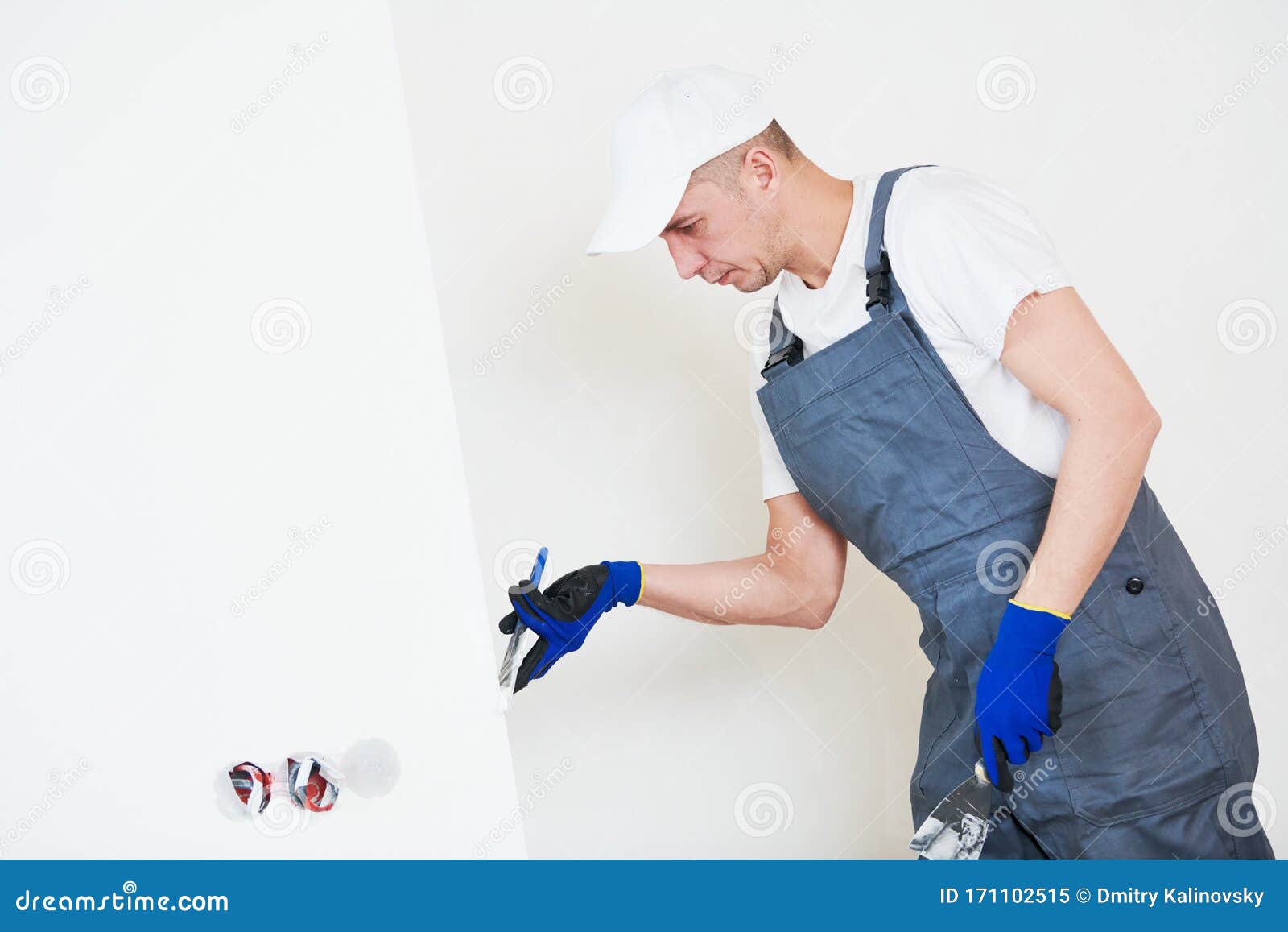 Refurbishment. Worker Spackling a Wall with Putty Stock Image Image