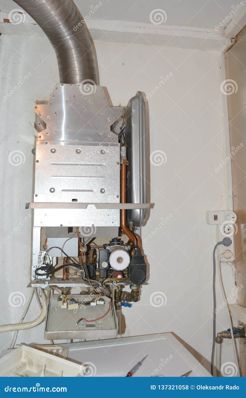 Repair of a Gas Boiler, Setting Up and Servicing Gas Boiler Stock Photo