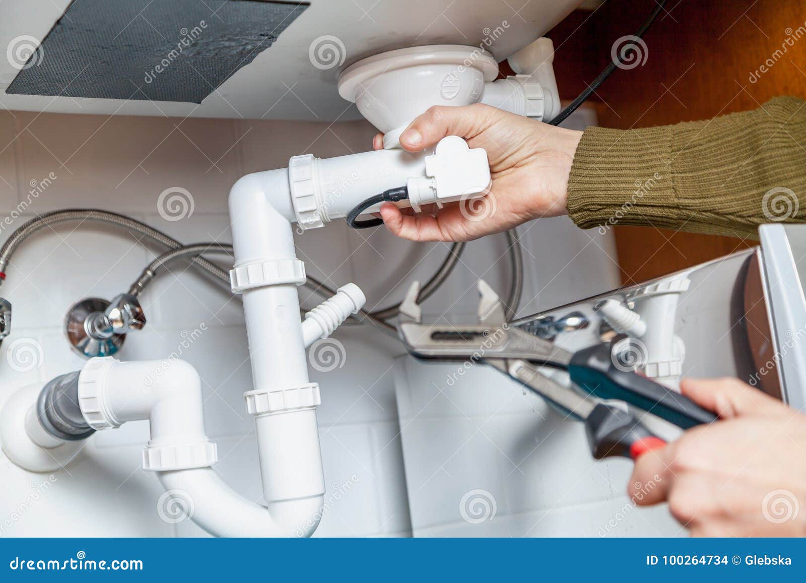 Repair Of Kitchen Overflow Pipe Wrench Closeup Stock Photo
