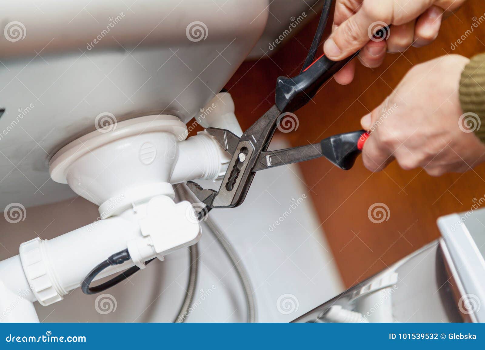 Repair Of Kitchen Overflow Pipe Wrench Closeup Stock Photo