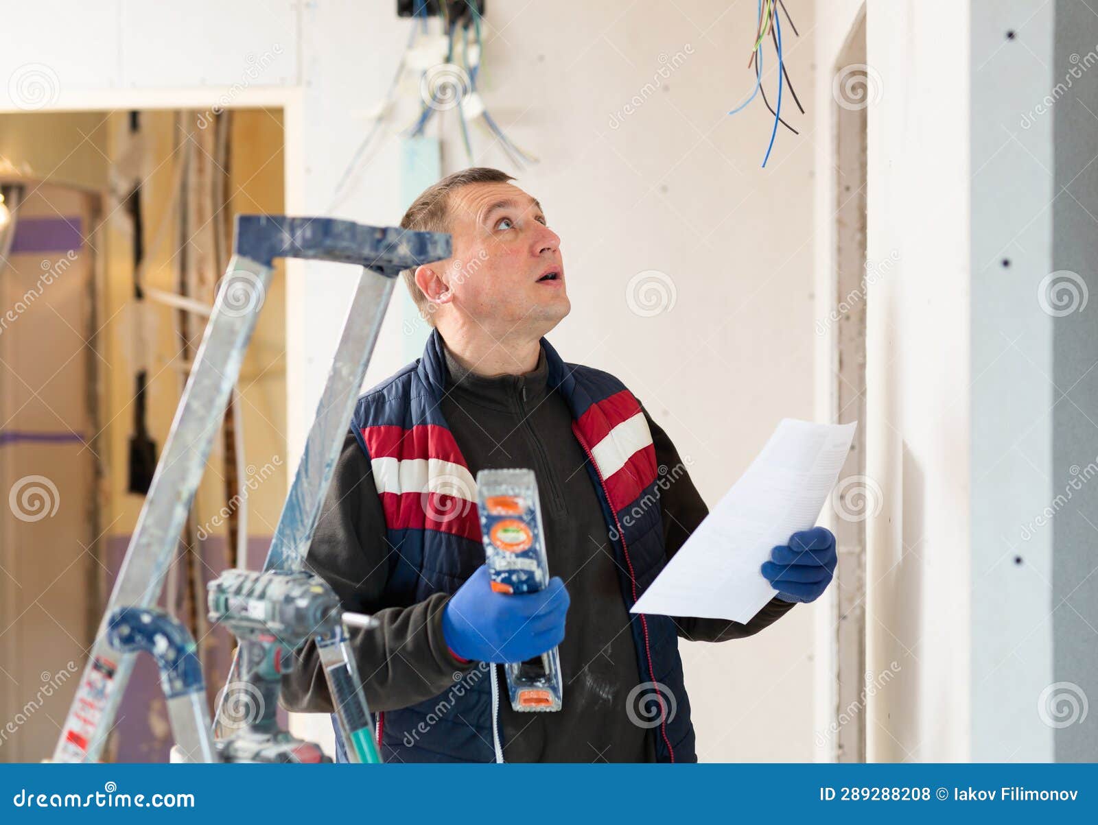 Repair Man Standing in Apartment and Checking Documentation Stock Photo Image of home